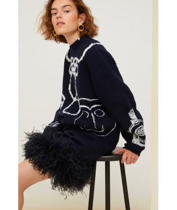 Feather-embellished pleated skirt s'inspire de l'anatomie humaine