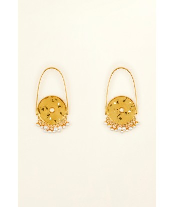 Circular brass and pearl earrings s'inspire de l'anatomie humaine